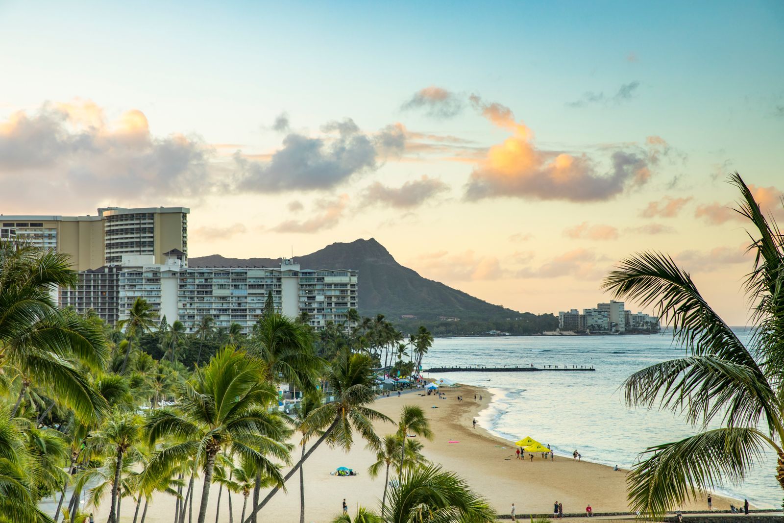 Palm trees, Waikiki Beach and Diamond Head at sunset, the view on many a cruise from Honolulu