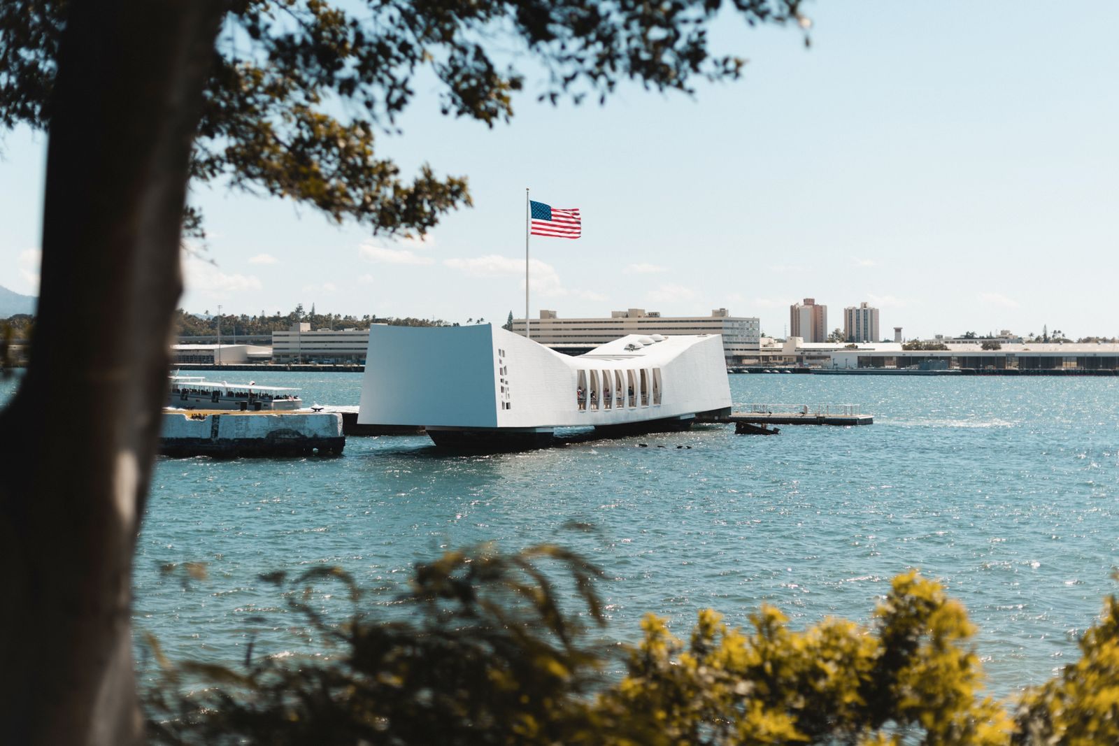 White USS Arizona Memorial on the water, the goal of a trip from the Honolulu cruise port to Pearl Harbor